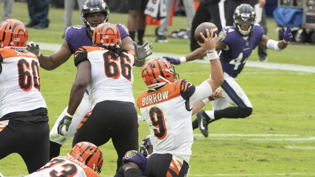 Oct 11, 2020; Baltimore, Maryland, USA; Baltimore Ravens linebacker Tyus Bowser (54) hits Cincinnati Bengals quarterback Joe Burrow (9) as he throws during the second quarter at M&T Bank Stadium. Mandatory Credit: Tommy Gilligan-USA TODAY Sports