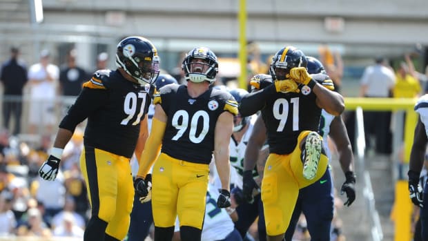 Sep 15, 2019; Pittsburgh, PA, USA; Pittsburgh Steelers linebacker T.J. Watt (90) celebrates a sack of Seattle Seahawks quarterback Russell Wilson (3) with teammates Cameron Heyward (97) and Stephon Tuitt (91) during the first quarter at Heinz Field. Mandatory Credit: Philip G. Pavely-USA TODAY Sports