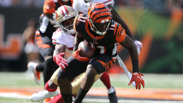 Cincinnati Bengals wide receiver John Ross (11) spins out of a tackle after making a reception in the fourth quarter of a Week 2 NFL football game against the San Francisco 49ers, Sunday, Sept. 15, 2019, at Paul Brown Stadium in Cincinnati. San Francisco 49ers At Cincinnati Bengals Sept 15