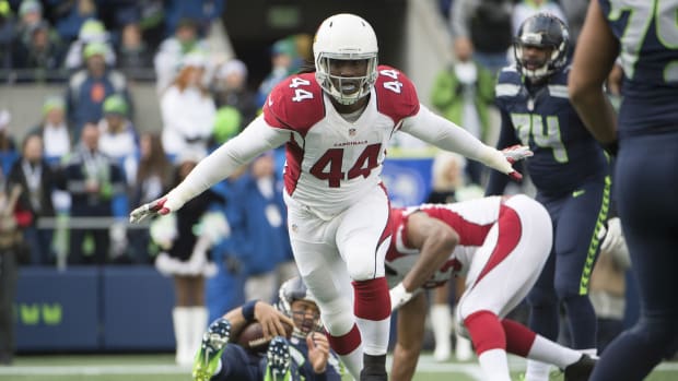 Arizona Cardinals outside linebacker Markus Golden (44) celebrates after sacking Seattle Seahawks quarterback Russell Wilson (3) in a game at CenturyLink Field. The Cardinals won 34-31.