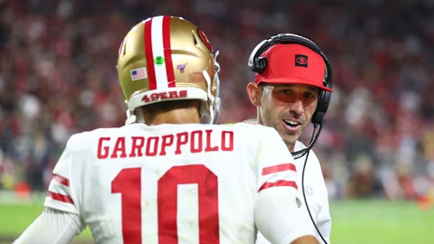 San Francisco 49ers quarterback Jimmy Garoppolo (10) with head coach Kyle Shanahan against the Arizona Cardinals at State Farm Stadium.