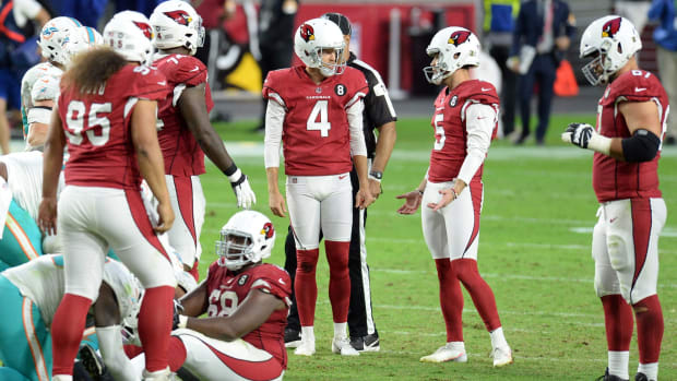 Arizona Cardinals kicker Zane Gonzalez (5) reacts alongside Arizona Cardinals punter Andy Lee (4) after missing a potential game tying field goal against the Miami Dolphins during the second half at State Farm Stadium.
