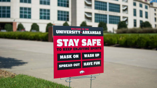 A sign at Arkansa warns students to stay safe "to keep enjoying sports"