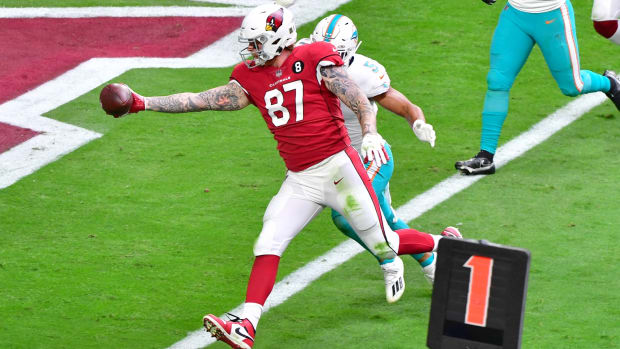 Arizona Cardinals tight end Maxx Williams (87) scores a touchdown against Miami Dolphins outside linebacker Kamu Grugier-Hill (51) during the first half at State Farm Stadium.