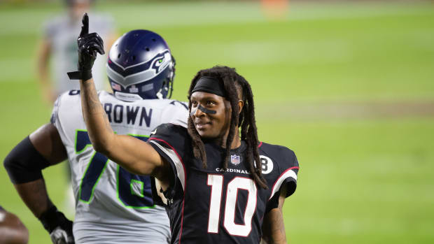 Arizona Cardinals wide receiver Deandre Hopkins (10) motions against the Seattle Seahawks in the fourth quarter at State Farm Stadium.