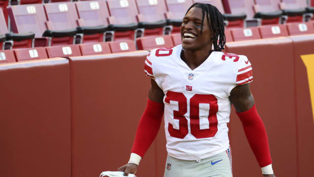 Nov 8, 2020; Landover, Maryland, USA; New York Giants cornerback Darnay Holmes (30) smiles while leaving the field after the Giants' game against the Washington Football Team at FedExField.
