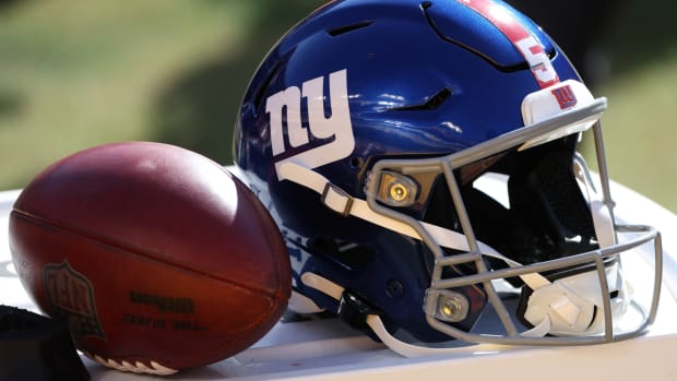 Nov 8, 2020; Landover, Maryland, USA; A view of the helmet of New York Giants kicker Graham Gano (not pictured) next to a ball on the sidelines against the Washington Football Team at FedEx Field.