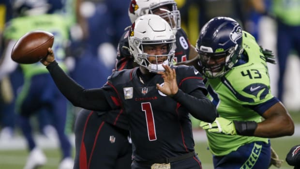 Arizona Cardinals quarterback Kyler Murray (1) throws a pass against the Seattle Seahawks during the first quarter at Lumen Field.