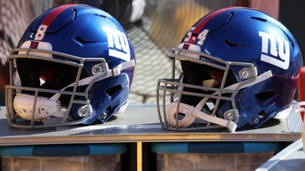 Nov 8, 2020; Landover, Maryland, USA; A view of the helmets of New York Giants quarterback Daniel Jones (8) and Giants inside linebacker Blake Martinez (54) resting on equipment case on the sidelines against the Washington Football Team at FedExField.