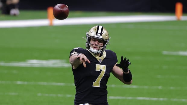 New Orleans Saints quarterback Taysom Hill (7) throws against the Atlanta Falcons during the first quarter at the Mercedes-Benz Superdome.