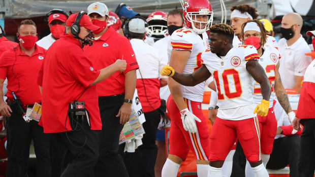 Nov 29, 2020; Tampa, Florida, USA; Kansas City Chiefs wide receiver Tyreek Hill (10) celebrates with head coach Andy Reid his touchdown scored against the Tampa Bay Buccaneers during the first half at Raymond James Stadium. Mandatory Credit: Kim Klement-USA TODAY Sports