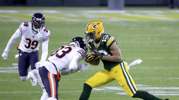 Green Bay Packers wide receiver Allen Lazard (13) catches a pass in front of the Chicago Bears cornerback Jaylon Johnson (33) on Sunday, November 29, 2020, at Lambeau Field in Green Bay, Wis