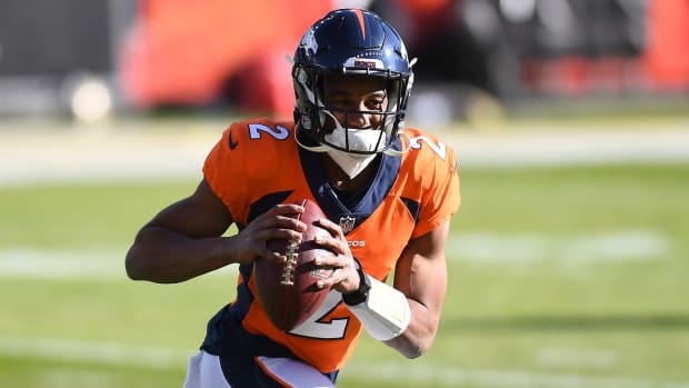 Denver Broncos quarterback Kendall Hinton (2) warms up before a game against the New Orleans Saints at Empower Field at Mile High.