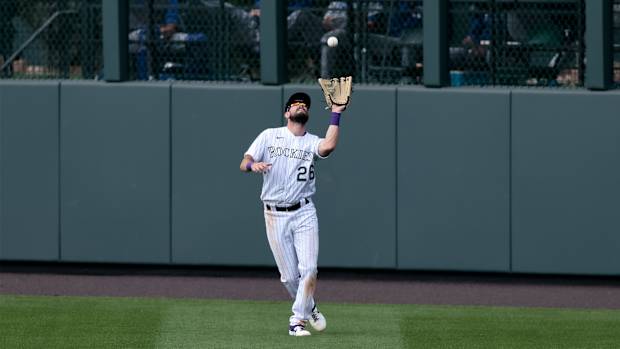 Sep 20, 2020; Denver, Colorado, USA; Colorado Rockies center fielder David Dahl (26) makes a catch for an out in the ninth inning against the Los Angeles Dodgers at Coors Field.