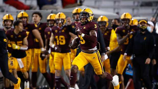 Running back Rachaad White #3 of the Arizona State Sun Devils carries the football for a 93-yard rushing touchdown against the Arizona Wildcats during the first half of the NCAAF game at Arizona Stadium on December 11, 2020 in Tucson, Arizona.