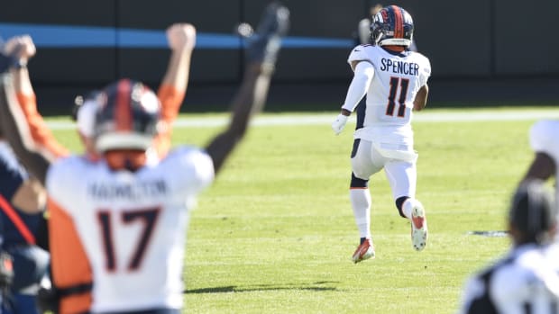 Denver Broncos punt returner Spencer (11) returns a punt for a touchdown in the first quarter at Bank of America Stadium.