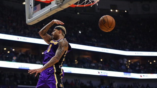 Mar 1, 2020; New Orleans, Louisiana, USA; Los Angeles Lakers forward Kyle Kuzma (0) dunks the ball against the New Orleans Pelicans during the first quarter at the Smoothie King Center.