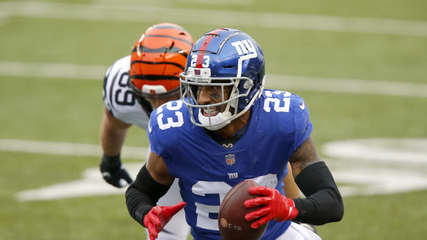 Nov 29, 2020; Cincinnati, Ohio, USA; New York Giants free safety Logan Ryan (23) runs with the ball after recovering the forced fumble during the fourth quarter against the Cincinnati Bengals at Paul Brown Stadium.