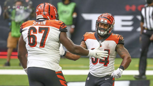 Dec 27, 2020; Houston, Texas, USA; Cincinnati Bengals running back Samaje Perine (34) celebrates with offensive guard Quinton Spain (67) after scoring a touchdown against the Houston Texans during the fourth quarter at NRG Stadium. Mandatory Credit: Troy Taormina-USA TODAY Sports