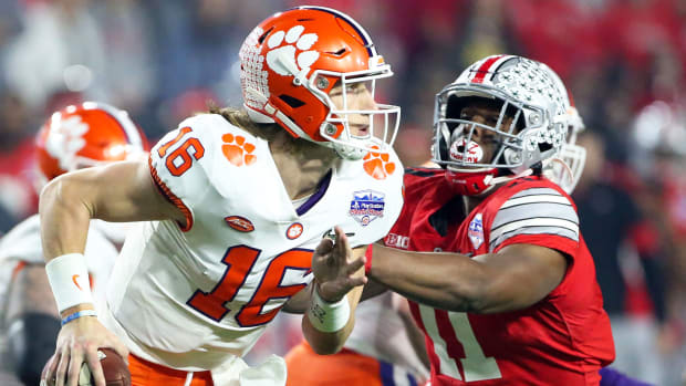 Clemson QB Trevor Lawrence runs vs Ohio State last season