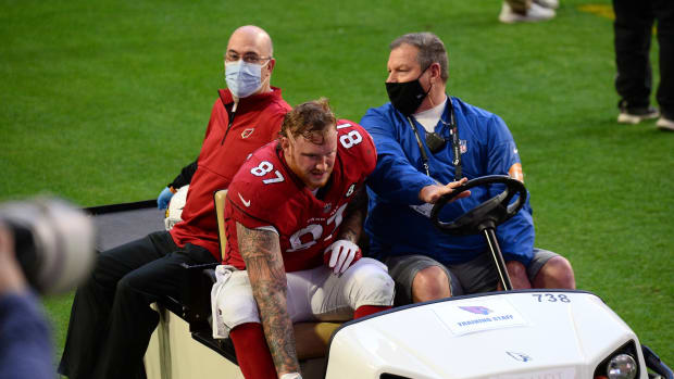 Arizona Cardinals tight end Maxx Williams (87) is carted off the field against the Philadelphia Eagles during the first half at State Farm Stadium.