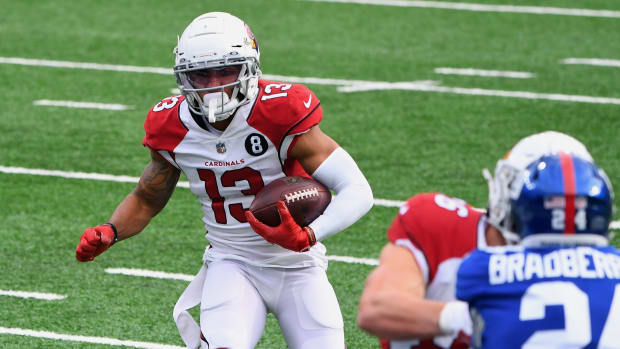 Arizona Cardinals wide receiver Christian Kirk (13) runs the ball against the New York Giants during the first half at MetLife Stadium.
