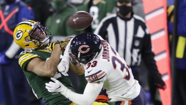 Green Bay Packers wide receiver Allen Lazard (13) is hit hard by Chicago Bears cornerback Jaylon Johnson (33) in the third quarter during their football game Sunday, November 29, 2020, at Lambeau Field in Green Bay, Wis.