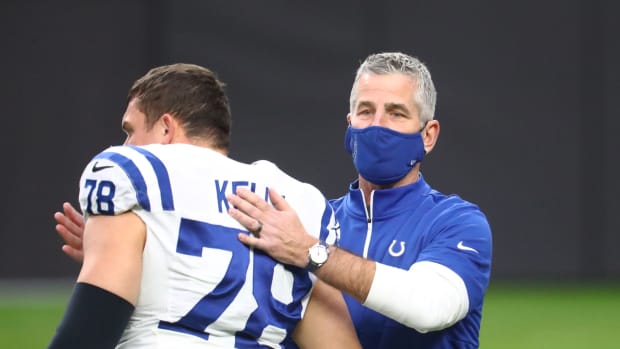 Indianapolis Colts head coach Frank Reich pats center Ryan Kelly on the back in Las Vegas.