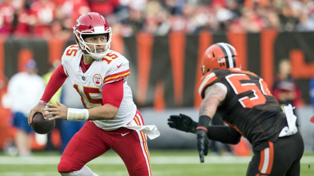 Nov 4, 2018; Cleveland, OH, USA; Kansas City Chiefs quarterback Patrick Mahomes (15) scrambles from Cleveland Browns linebacker Tanner Vallejo (54) during the second half at FirstEnergy Stadium. Mandatory Credit: Ken Blaze-USA TODAY Sports