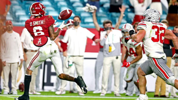 Alabama's DeVonta Smith catches a touchdown pass in front of Ohio State's Tuf Borland