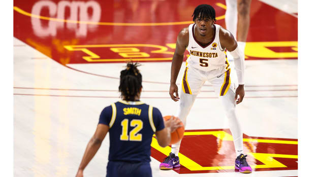 Jan 16, 2021; Minneapolis, Minnesota, USA; Minnesota Gophers guard Marcus Carr (5) guards Michigan Wolverines guard Mike Smith (12) during the first half at Williams Arena.