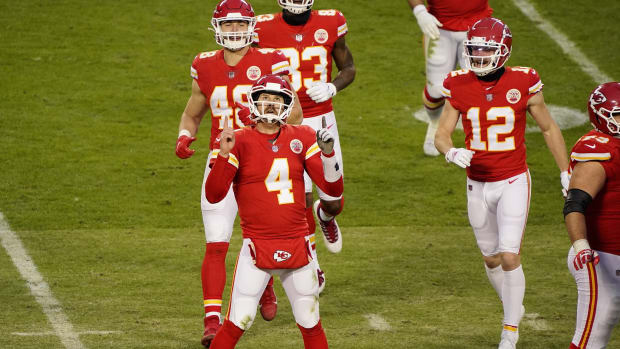 Jan 17, 2021; Kansas City, Missouri, USA; Kansas City Chiefs quarterback Chad Henne (4) celebrates the victory against the Cleveland Browns in the AFC Divisional Round playoff game at Arrowhead Stadium. Mandatory Credit: Jay Biggerstaff-USA TODAY Sports