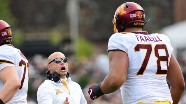 Minnesota Gophers head coach P.J. Fleck celebrates a touchdown with lineman Daniel Faalele (78) in the first half against the Purdue Boilermakers at Ross-Ade Stadium.