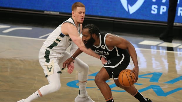 Jan 18, 2021; Brooklyn, New York, USA; Brooklyn Nets shooting guard James Harden (13) controls the ball against Milwaukee Bucks shooting guard Donte DiVincenzo (0) during the fourth quarter at Barclays Center. The Nets defeated the Bucks 125-123. Mandatory Credit: Brad Penner-USA TODAY Sports
