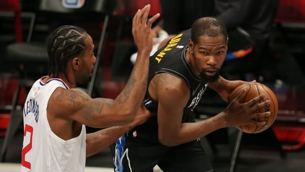 Brooklyn Nets power forward Kevin Durant (7) controls the ball against Los Angeles Clippers small forward Kawhi Leonard (2) during the first quarter at Barclays Center.