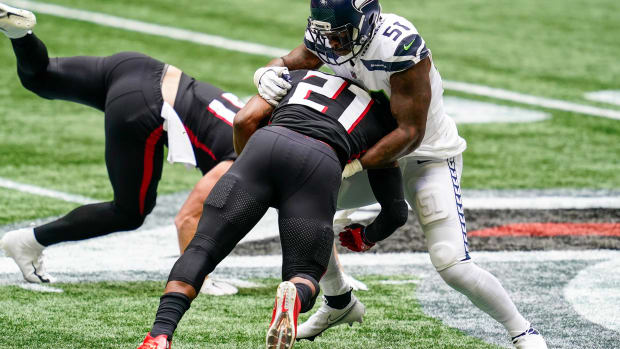 Seattle Seahawks linebacker Bruce Irvin (51) tackles Atlanta Falcons running back Todd Gurley (21) during the first half at Mercedes-Benz Stadium.