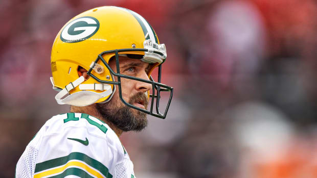 Aaron Rodgers looks to the stands during a break in the action of a Packers game.