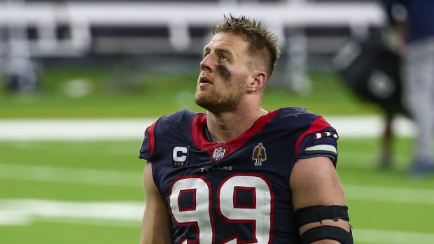 J.J. Watt walks off the field after a loss to the Titans