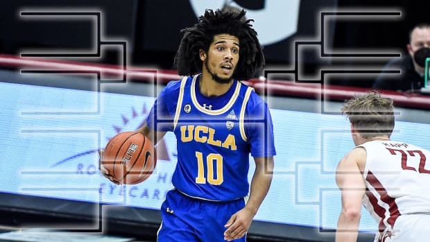 UCLA guard Tyger Campbell dribbles