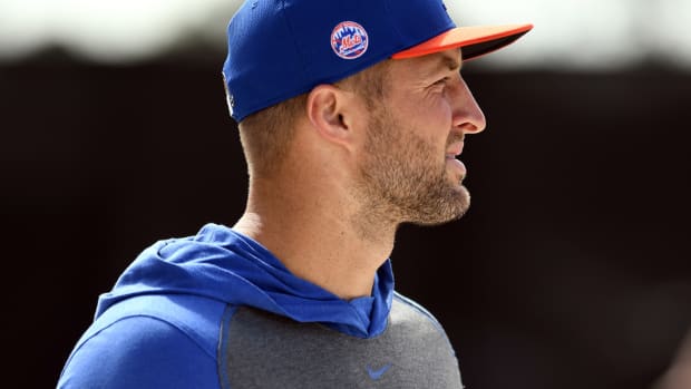 Feb 16, 2020; Port St. Lucie, Florida, USA; New York Mets prospect Tim Tebow walks between workout stations during spring training. Mandatory Credit: Jim Rassol-USA TODAY Sports