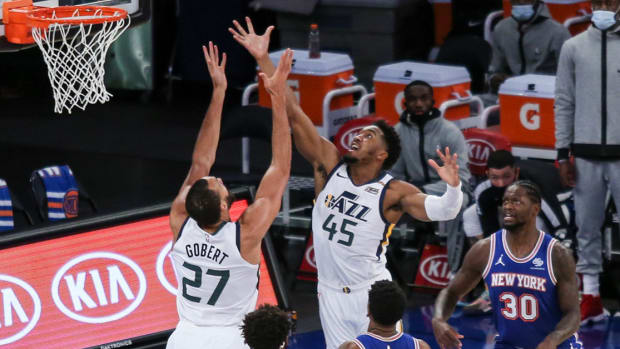 Jan 6, 2021; New York, New York, USA; Utah Jazz guard Donovan Mitchell (45) and center Rudy Gobert (27) go for a rebound against New York Knicks guard Elfrid Payton (6) and center Mitchell Robinson (23) during the first half at Madison Square Garden. Mandatory Credit: Wendell Cruz-USA TODAY Sports