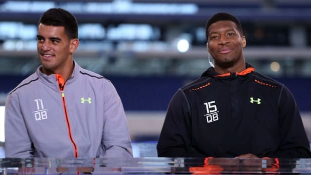 Florida State quarterback Jameis Winston (right) and Oregon Ducks quarterback Marcus Mariota do an interview on the NFL Network after finishing their workout during the 2015 NFL Combine at Lucas Oil Stadium.