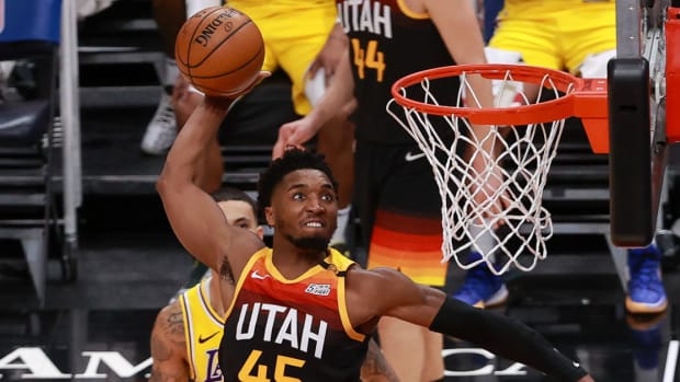 Utah Jazz guard Donovan Mitchell dunks the basketball