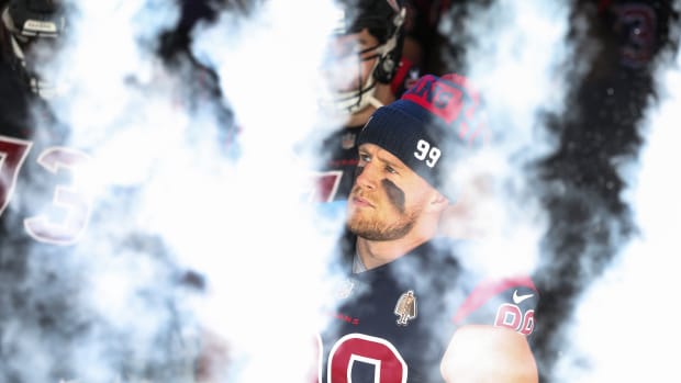 Dec 27, 2020; Houston, Texas, USA; Houston Texans defensive end J.J. Watt (99) waits with teammates to walk onto the field before a game against the Cincinnati Bengals at NRG Stadium. Mandatory Credit: Troy Taormina-USA TODAY Sports