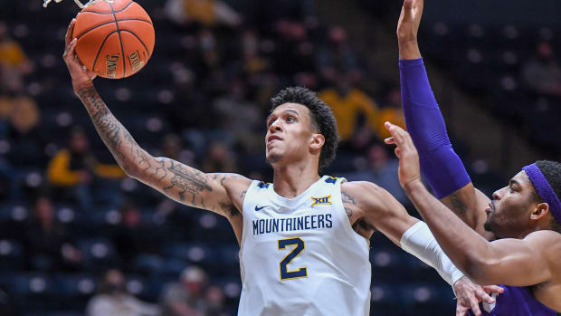 West Virginia forward Jalen Bridges drives the lane for one of his five field goals on the evening on his way to a career-high 22 points and grabbed a career-high 12 rebounds.