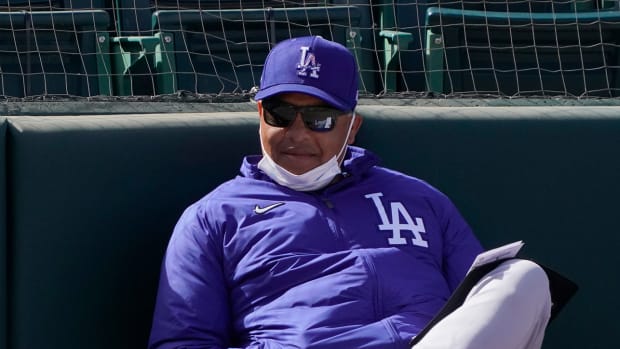 Dave Roberts watches a spring training game
