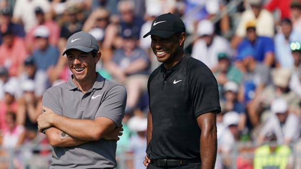 Rory McIlroy laughs with Tiger Woods at the 2018 PGA Championship