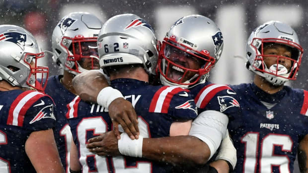 New England Patriots quarterback Cam Newton (1) hugs offensive guard Joe Thuney (62) during the forth quarter of a game against the New York Jets at Gillette Stadium.