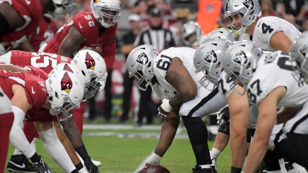 General overall view of the line of scrimmage as Oakland Raiders center Rodney Hudson (61) snaps the ball against the Arizona Cardinals during an NFL football game. The Raiders defeated the Cardinals 33-26.