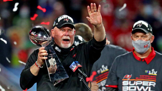 Feb 7, 2021; Tampa, FL, USA; Tampa Bay Buccaneers head coach Bruce Arians celebrates with the Vince Lombardi Trophy after the Tampa Bay Buccaneers beat the Kansas City Chiefs in Super Bowl LV at Raymond James Stadium. Mandatory Credit: Mark J. Rebilas-USA TODAY Sports